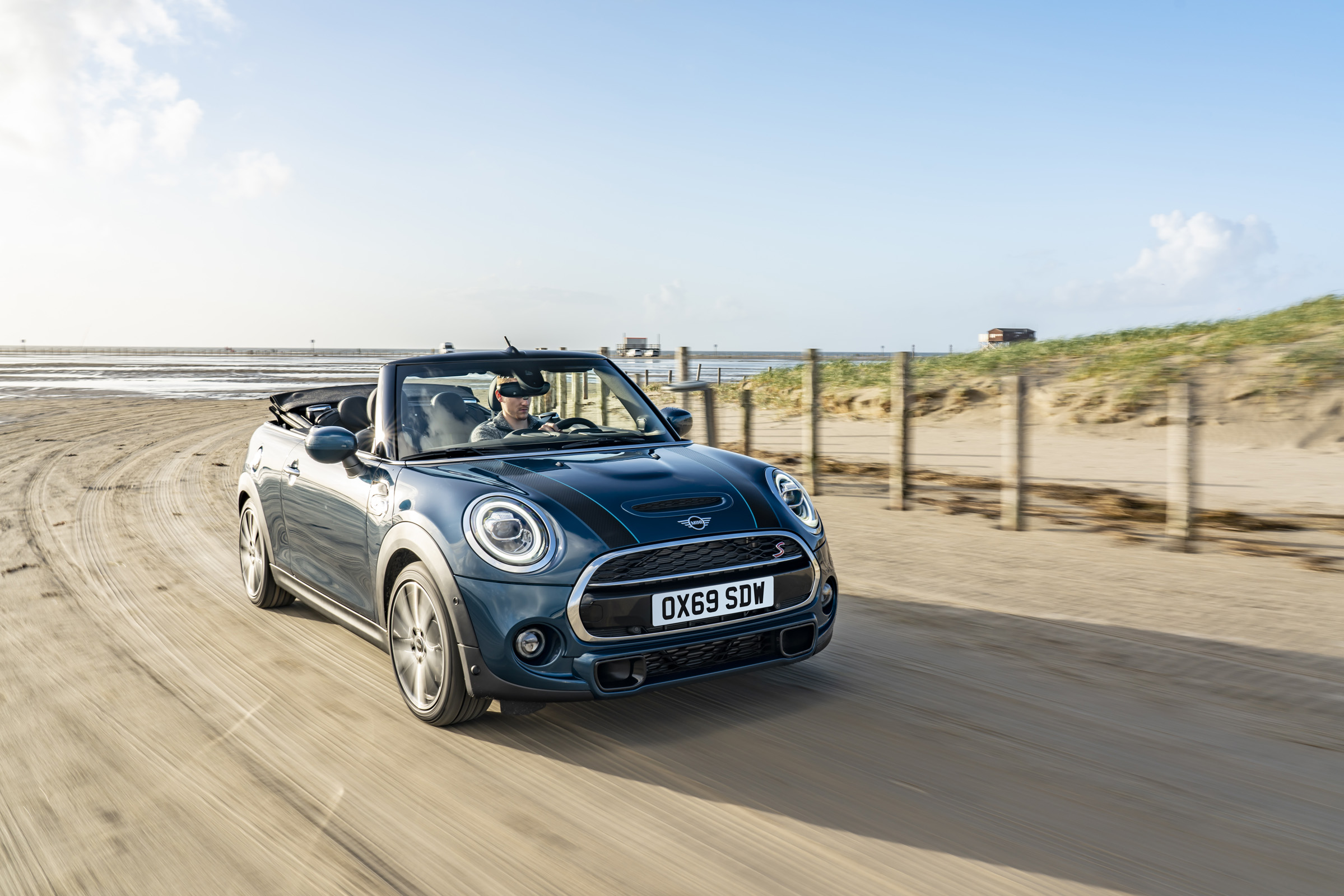 MINI Sidewalk Convertible driving on beach with roof down