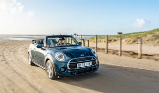 MINI Sidewalk Convertible driving on beach with roof down