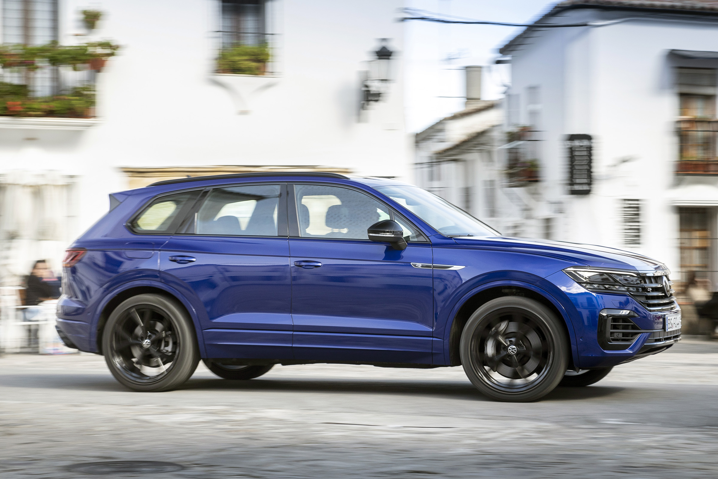 Volkswagen Touareg R driving through town - side view