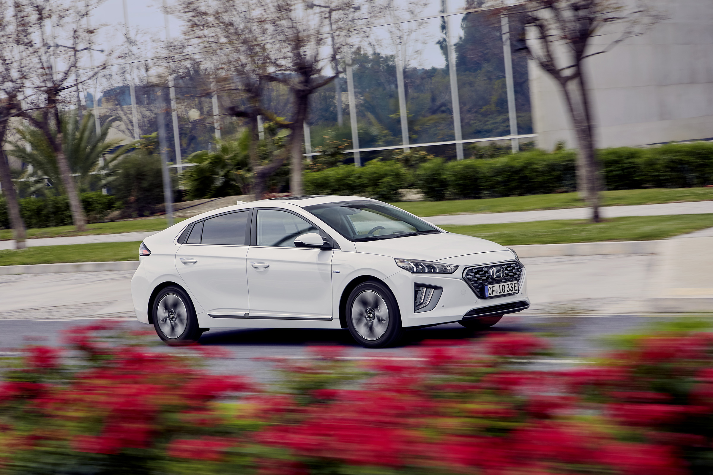 Hyundai Ioniq Plug-in Hybrid driving past flowers