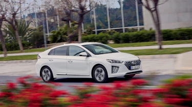 Hyundai Ioniq Plug-in Hybrid driving past flowers