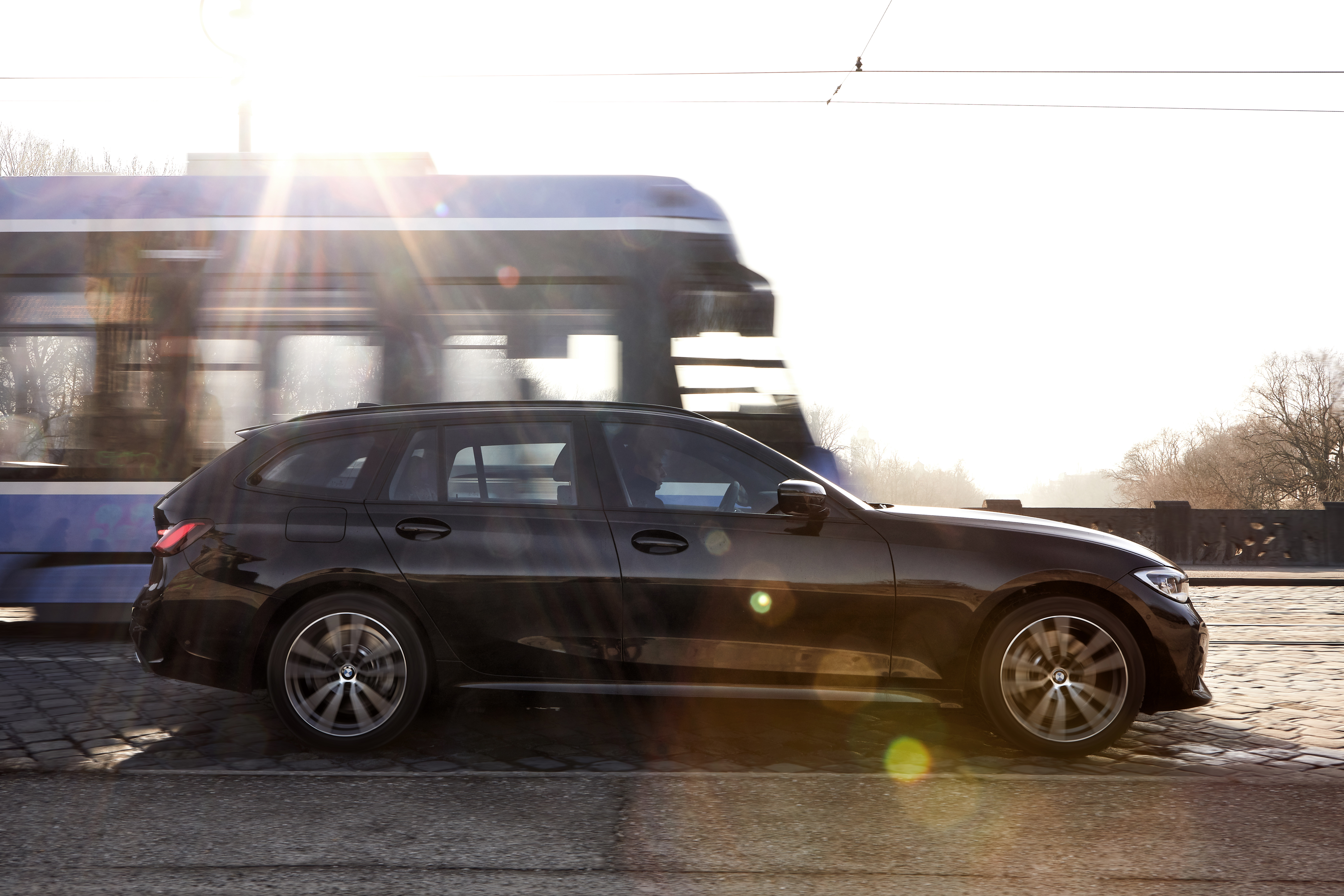 2020 BMW 330e Touring - side view dynamic 
