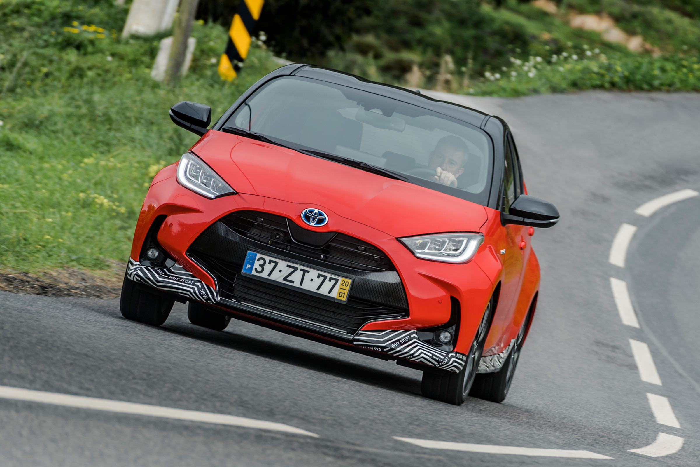 Toyota Yaris driving on road