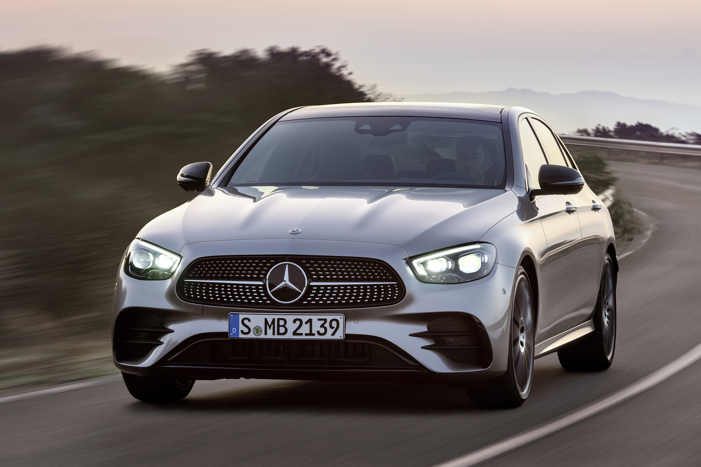 Mercedes E-Class driving - front view with headlights on