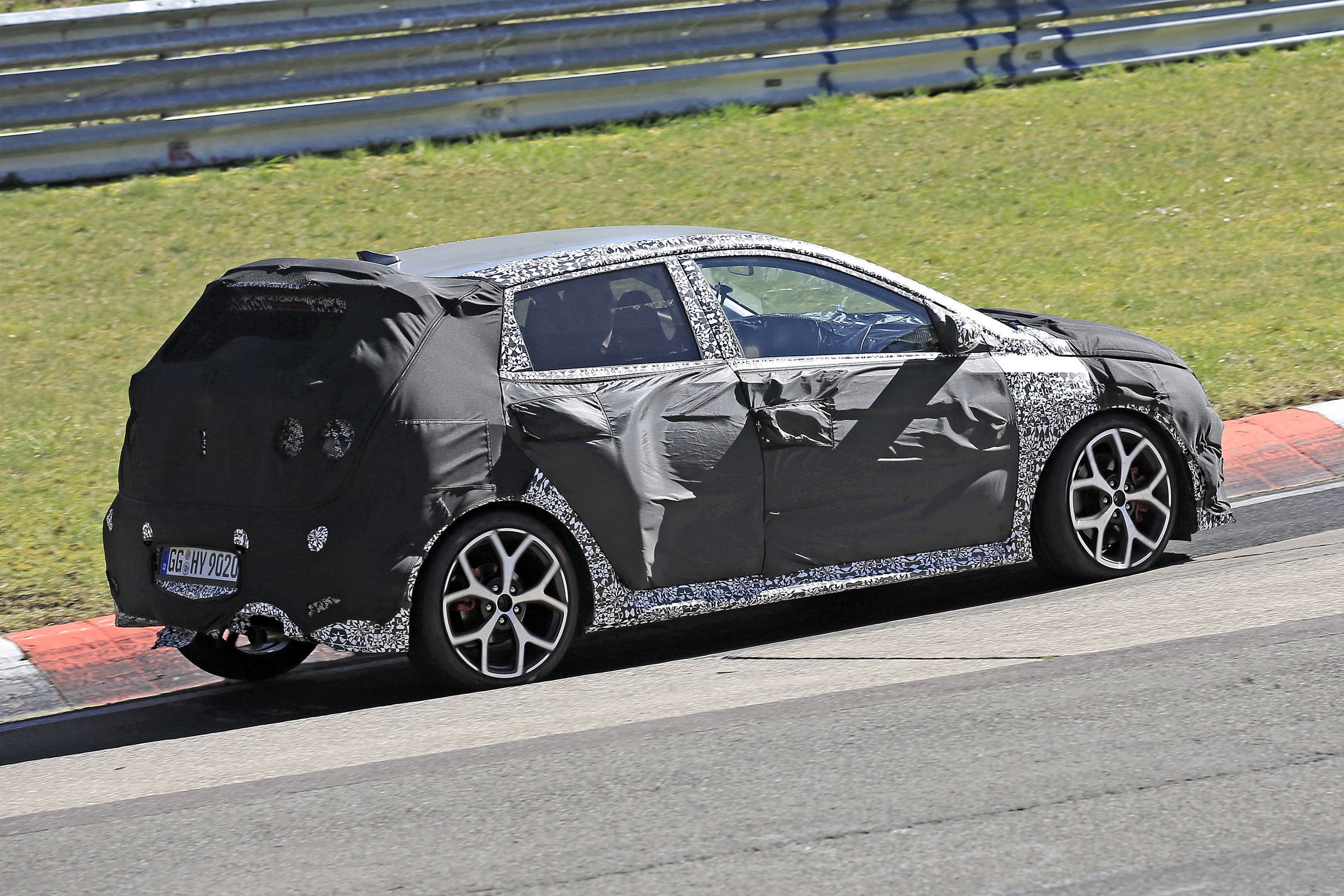 Hyundai i20 N development car - Nurburgring - rear 3/4 passing view