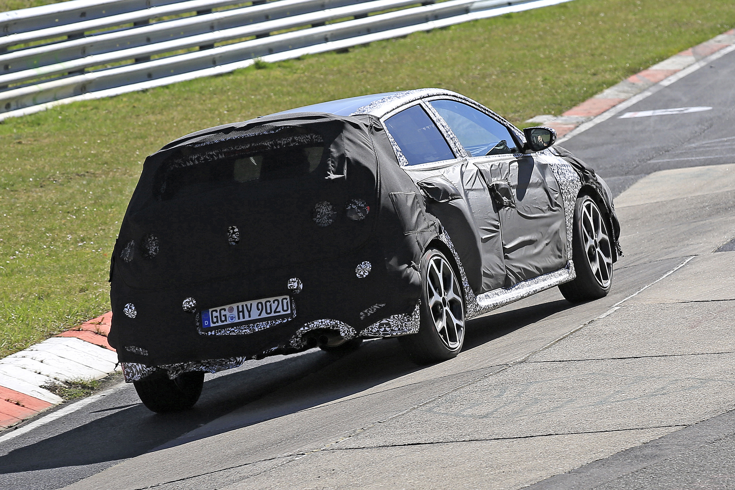 Hyundai i20 N development car - rear 3/4 view passing 