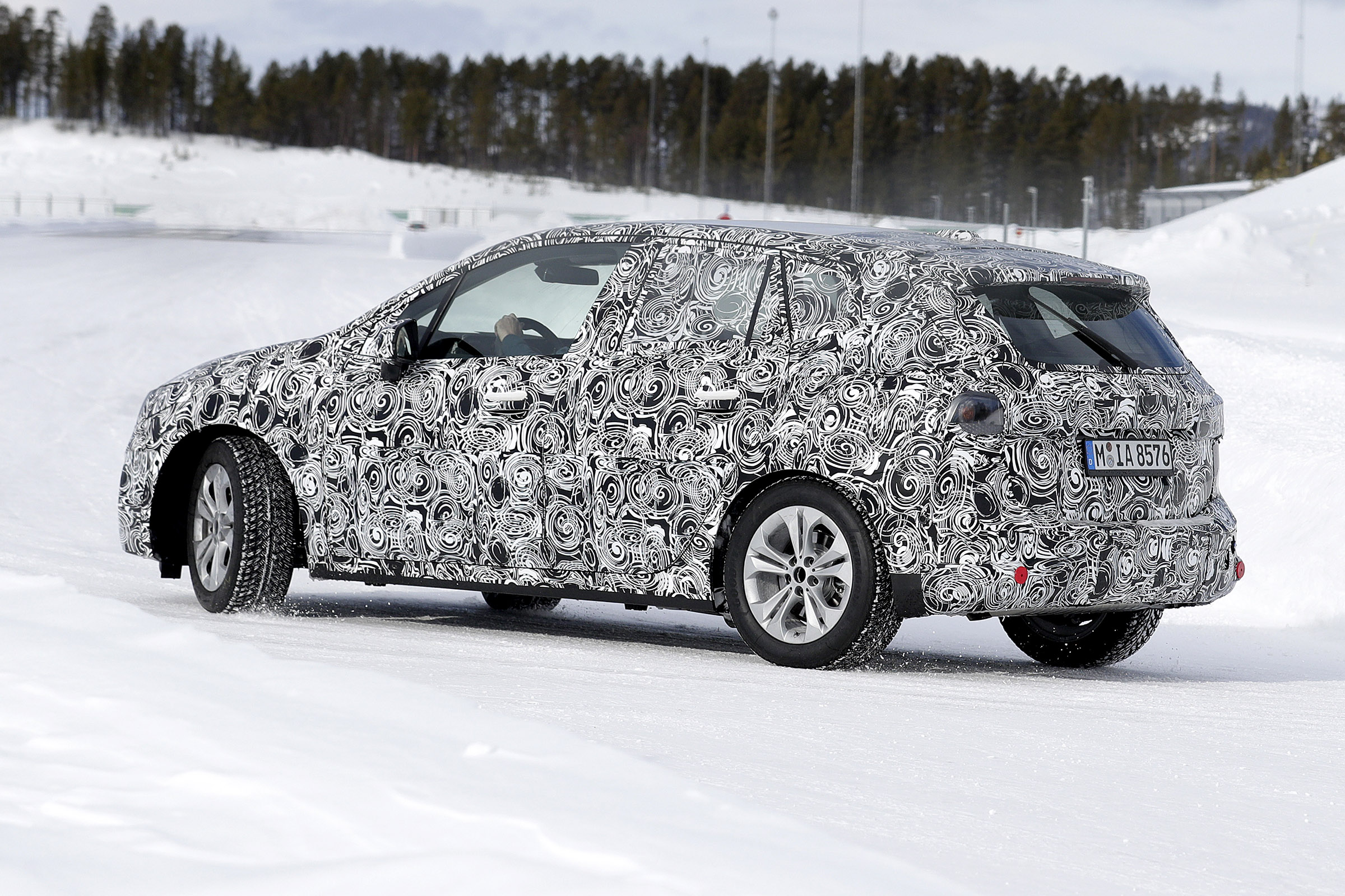 BMW 2 Series Active Tourer in camouflage - driving on frozen road