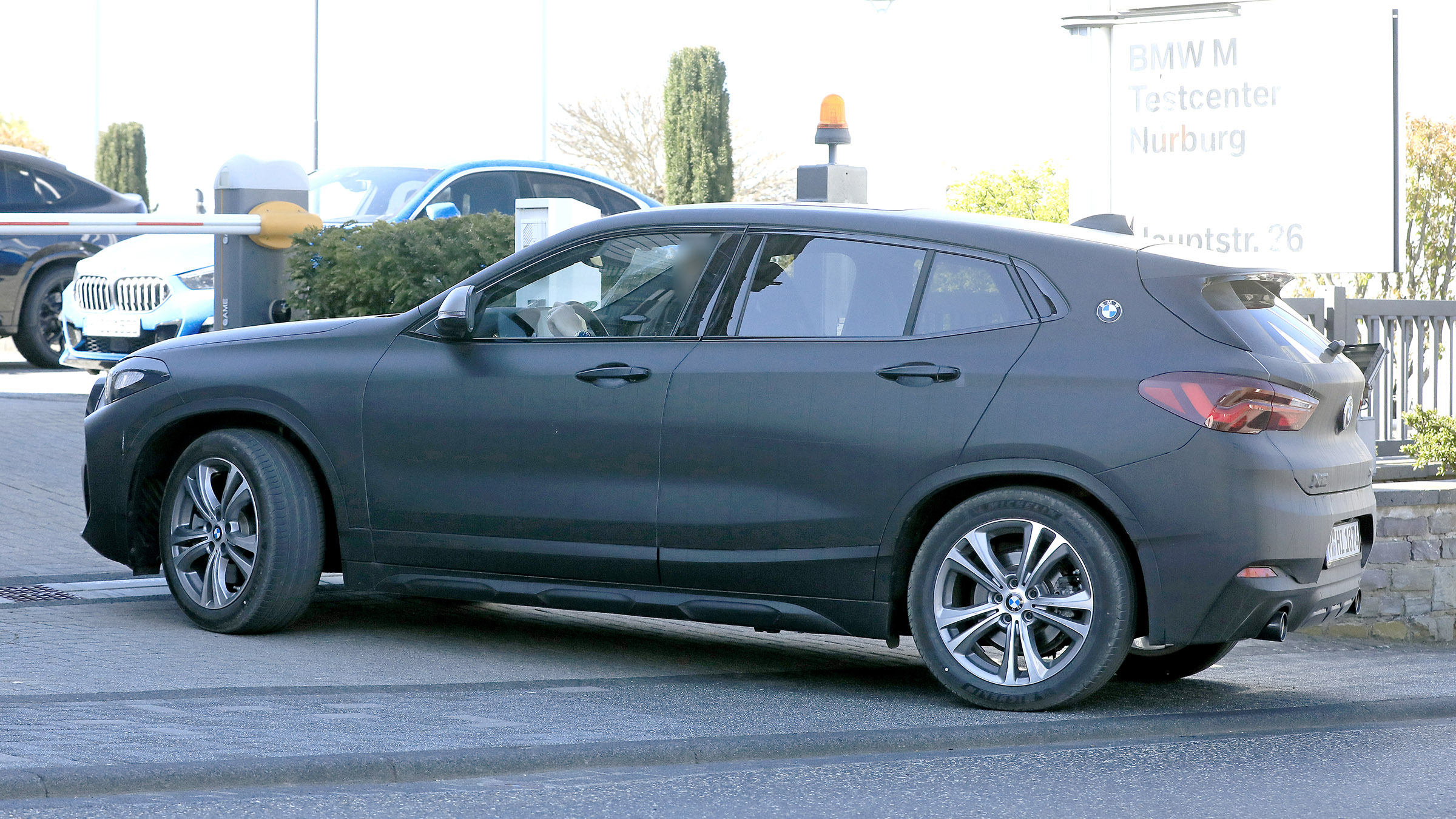 BMW X2 facelift in slight camouflage - side view