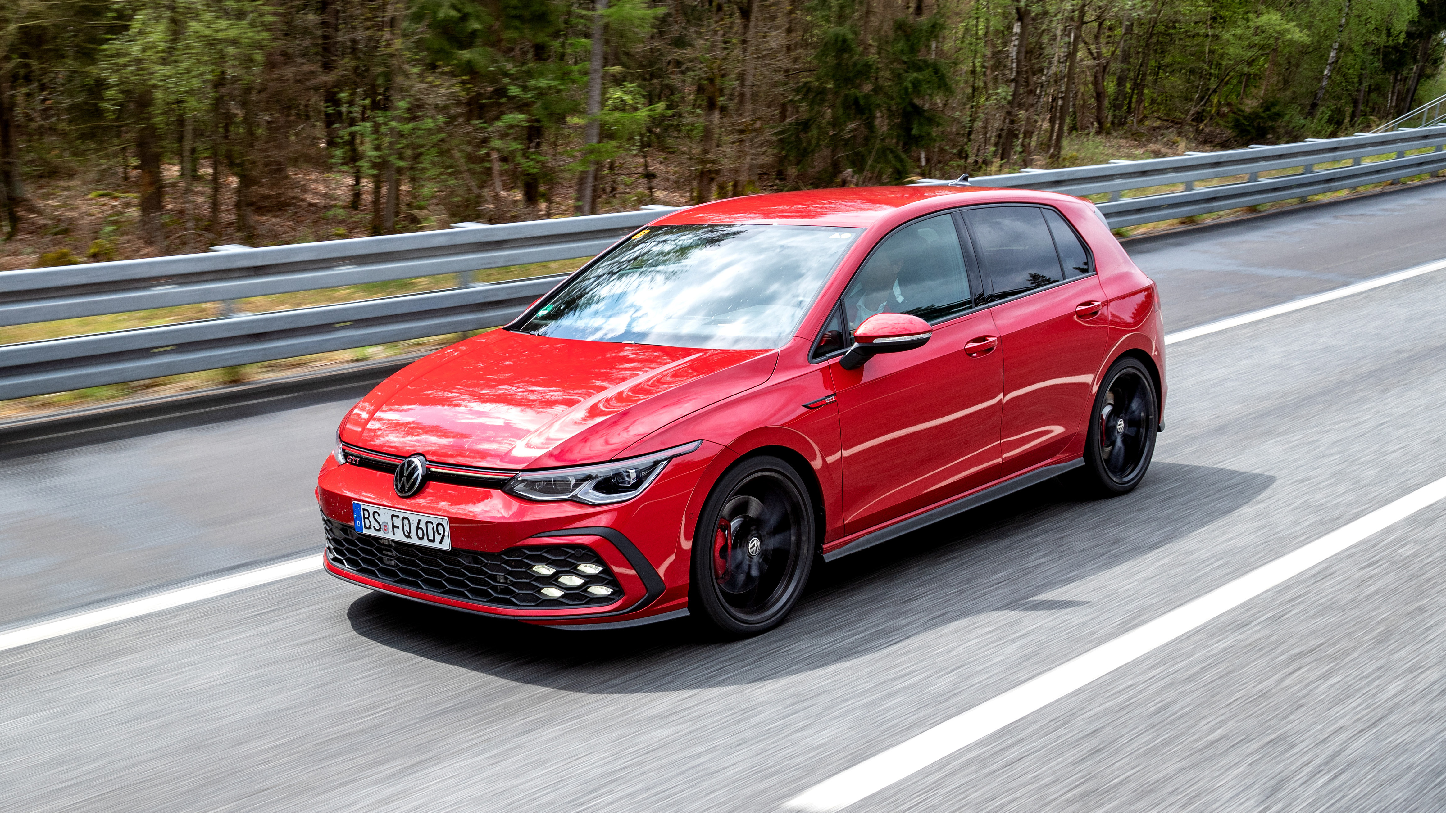 2020 Volkswagen Golf GTI  - front 3/4 view driving 