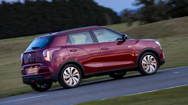 SsangYong Tivoli driving at dusk - rear