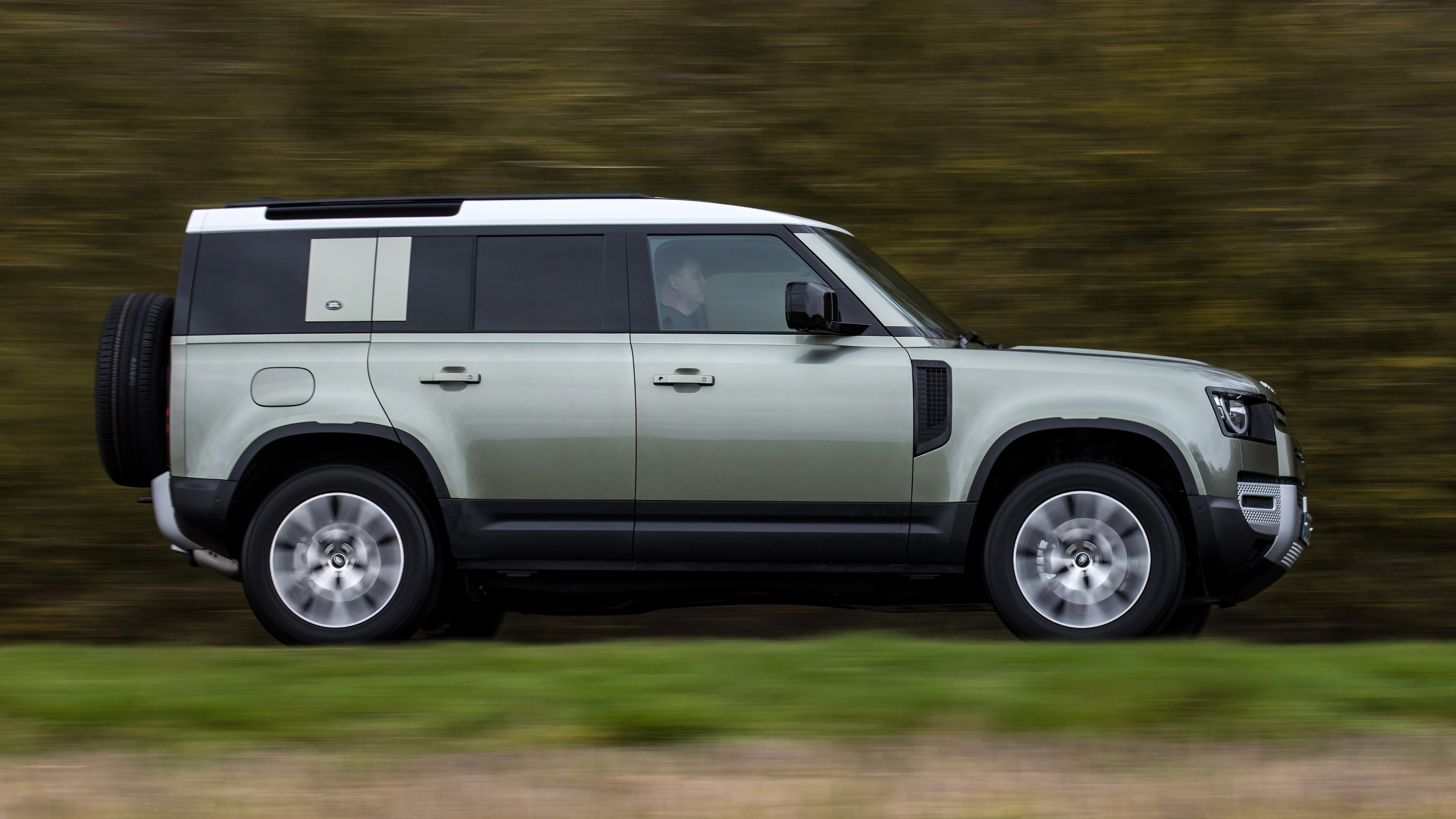 Land Rover Defender 110 - side view passing driving 