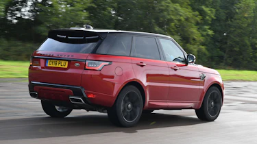 Range Rover Sport SUV driving rear view