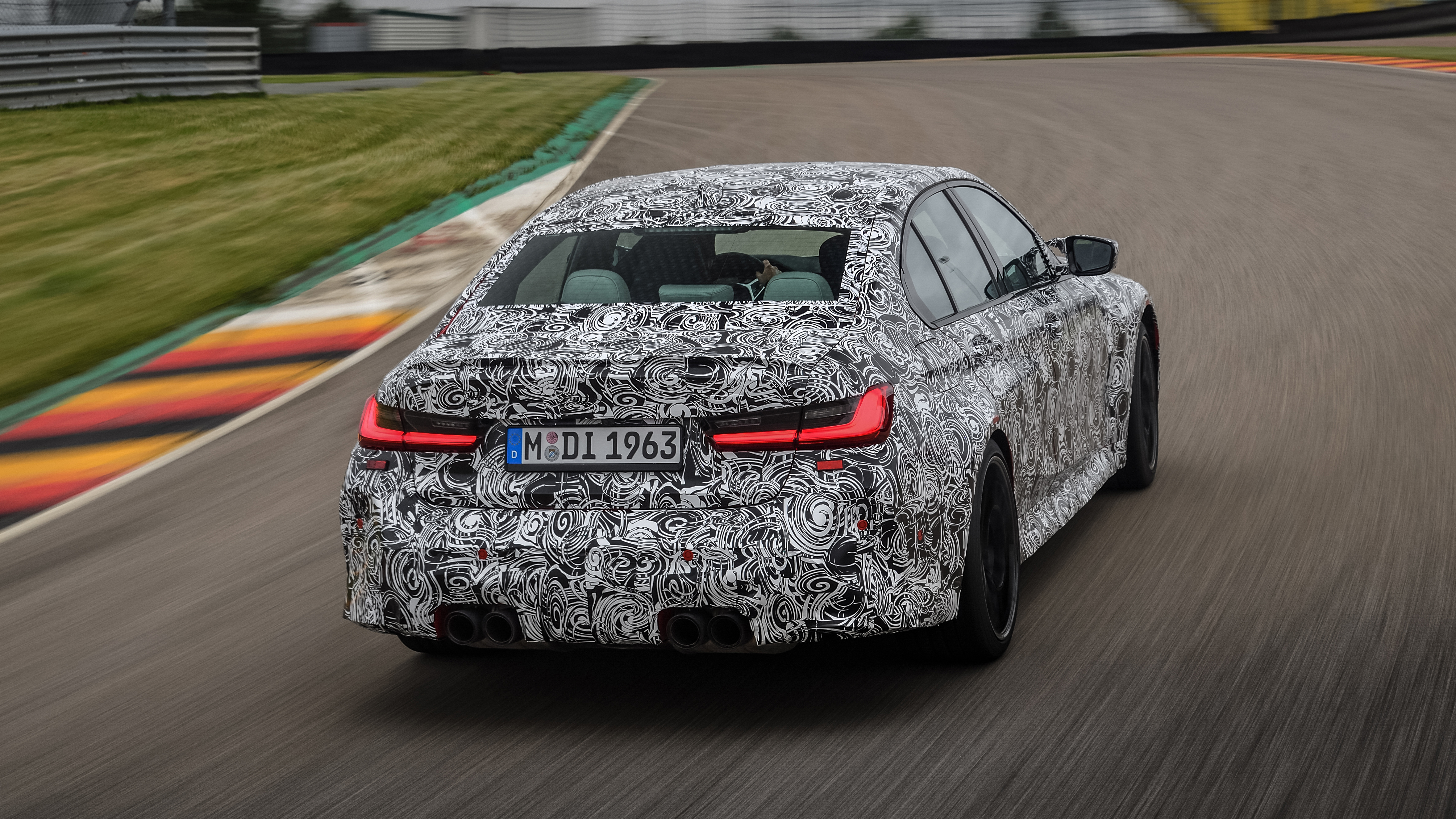 2020 BMW M3 saloon prototype - rear 3/4 view cornering 