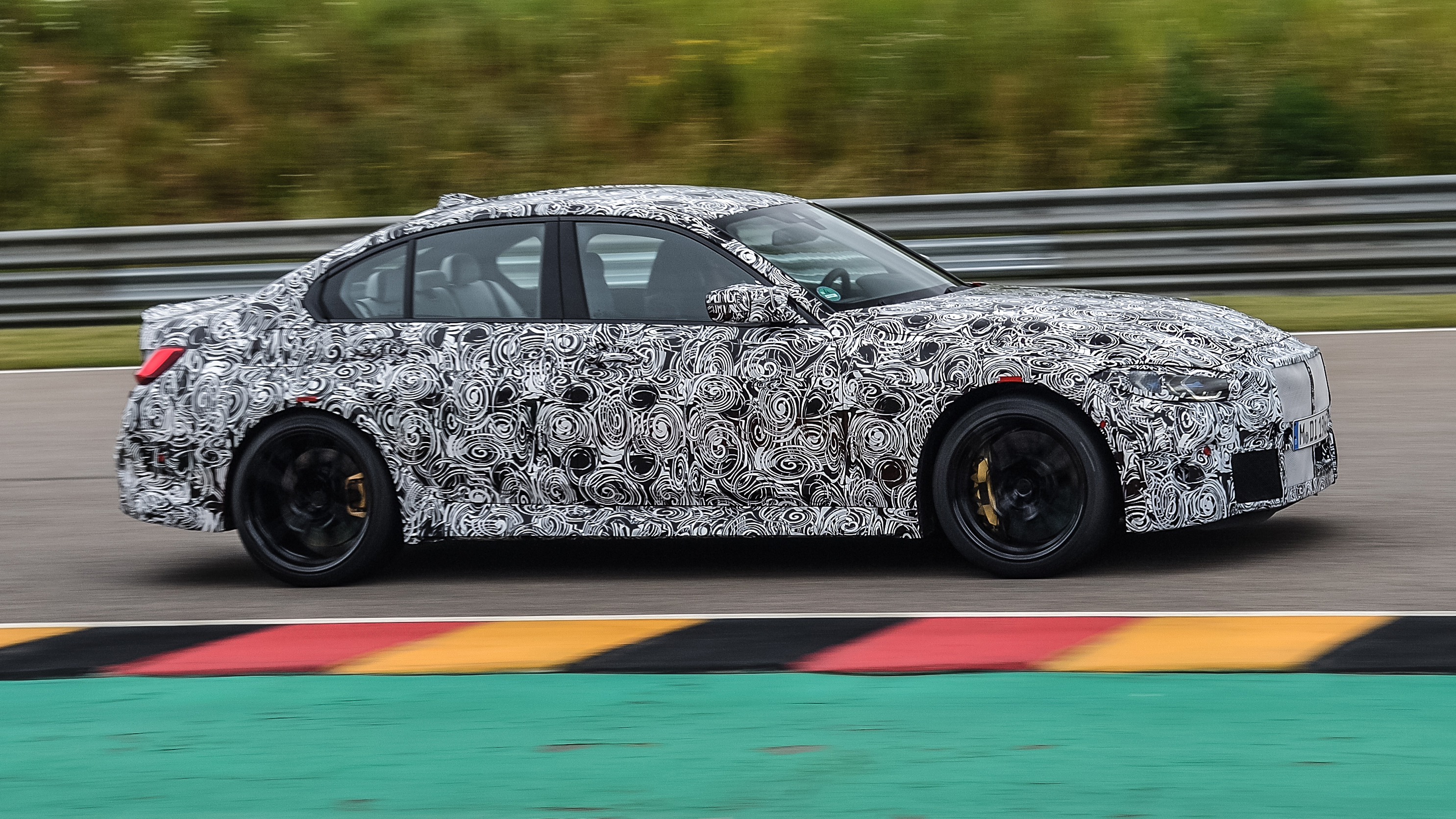 2020 BMW M3 saloon prototype - side on view passing 