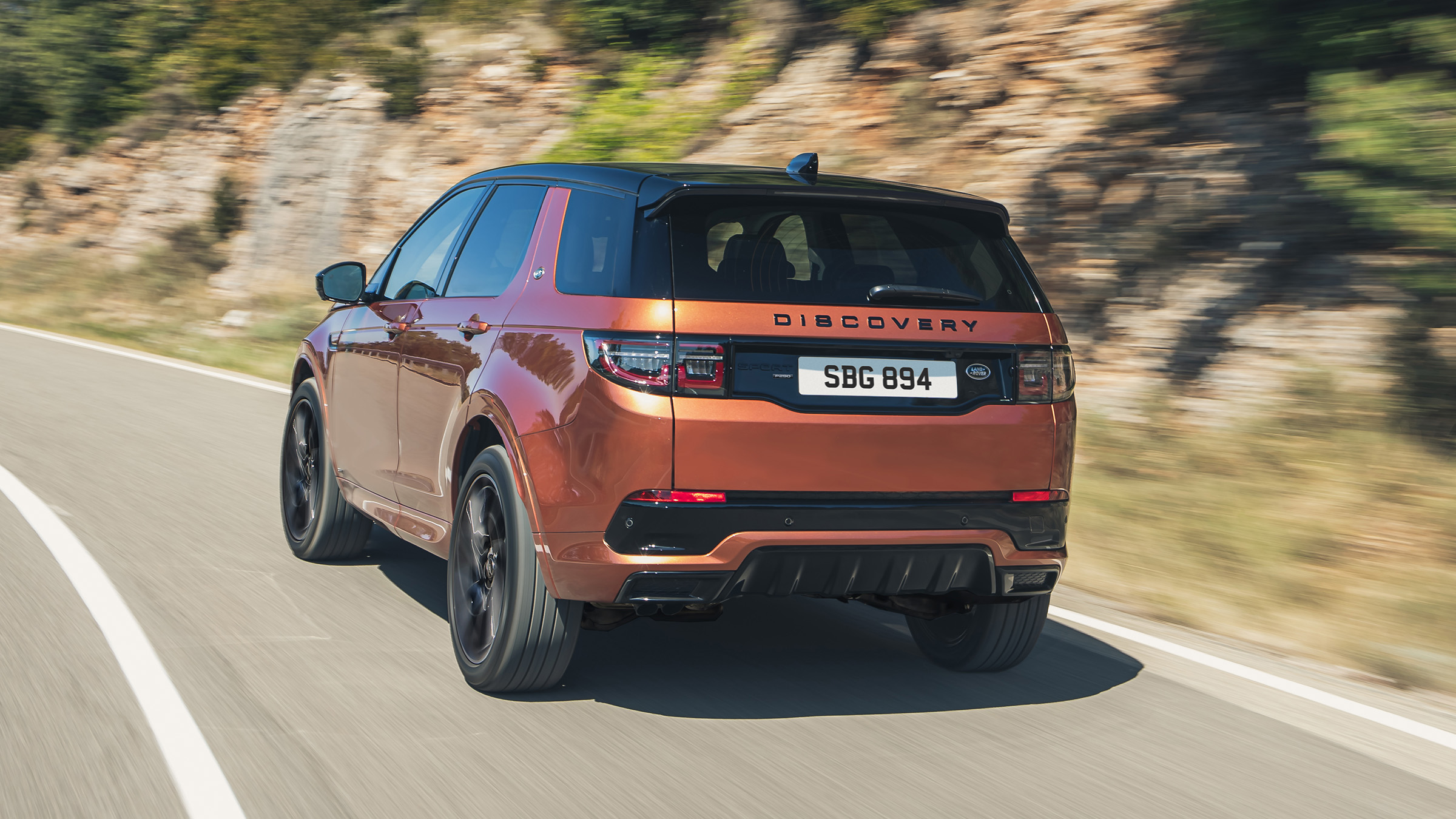 2020 Land Rover Discovery Sport Black - driving rear view
