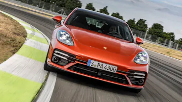 2020 Porsche Panamera Turbo S driving on racetrack