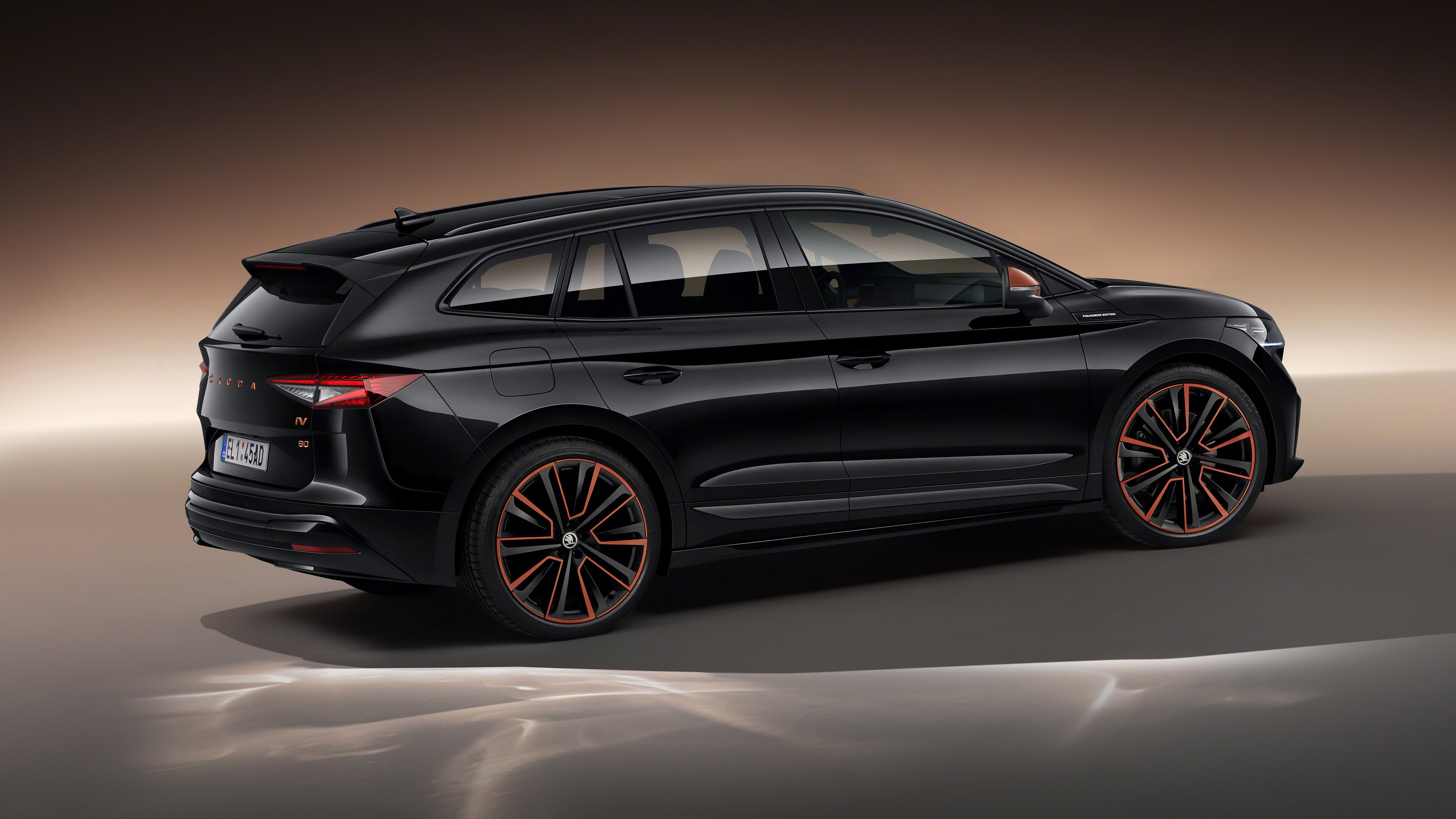2021 Skoda Enyaq iV - rear 3/4 static black/orange