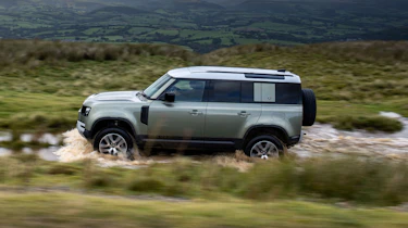 2020 Land Rover Defender 110 P400e plug-in hybrid - side view off-roading