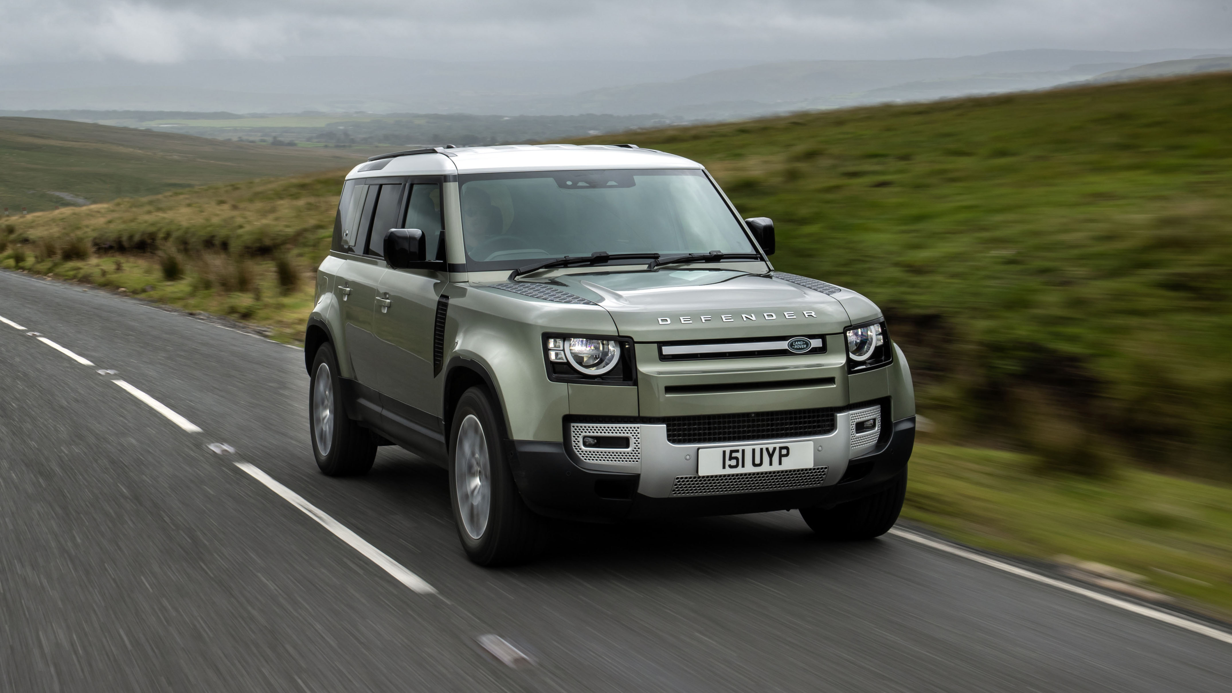 2020 Land Rover Defender 110 P400e plug-in hybrid - front 3/4 view on road