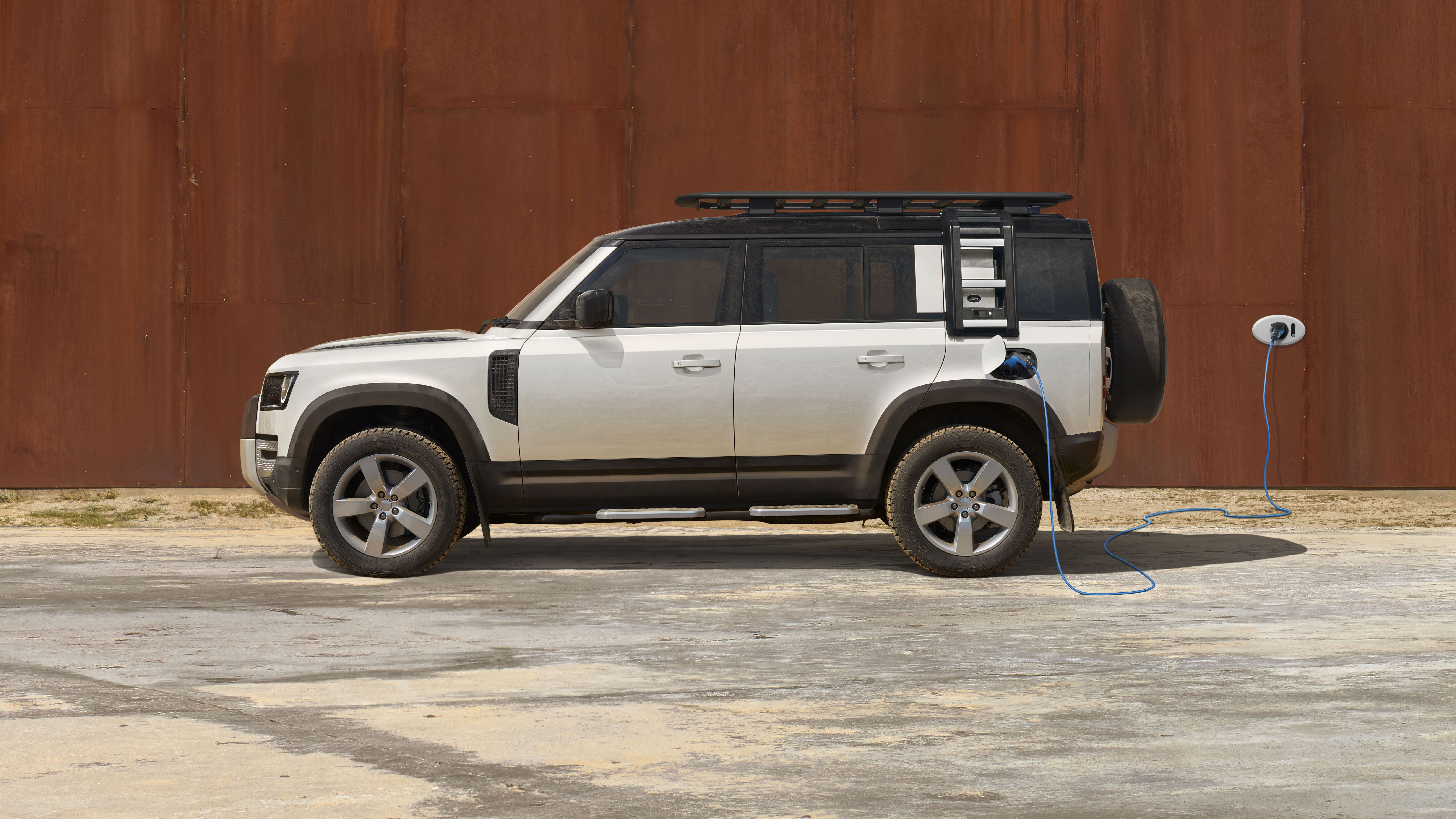 2020 Land Rover Defender 110 P400e plug-in hybrid - side view charging 