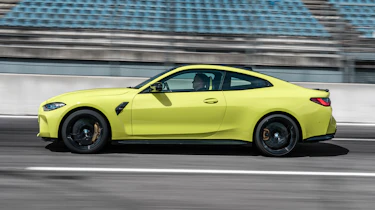 2021 BMW M4 Competition Coupe - side view dynamic