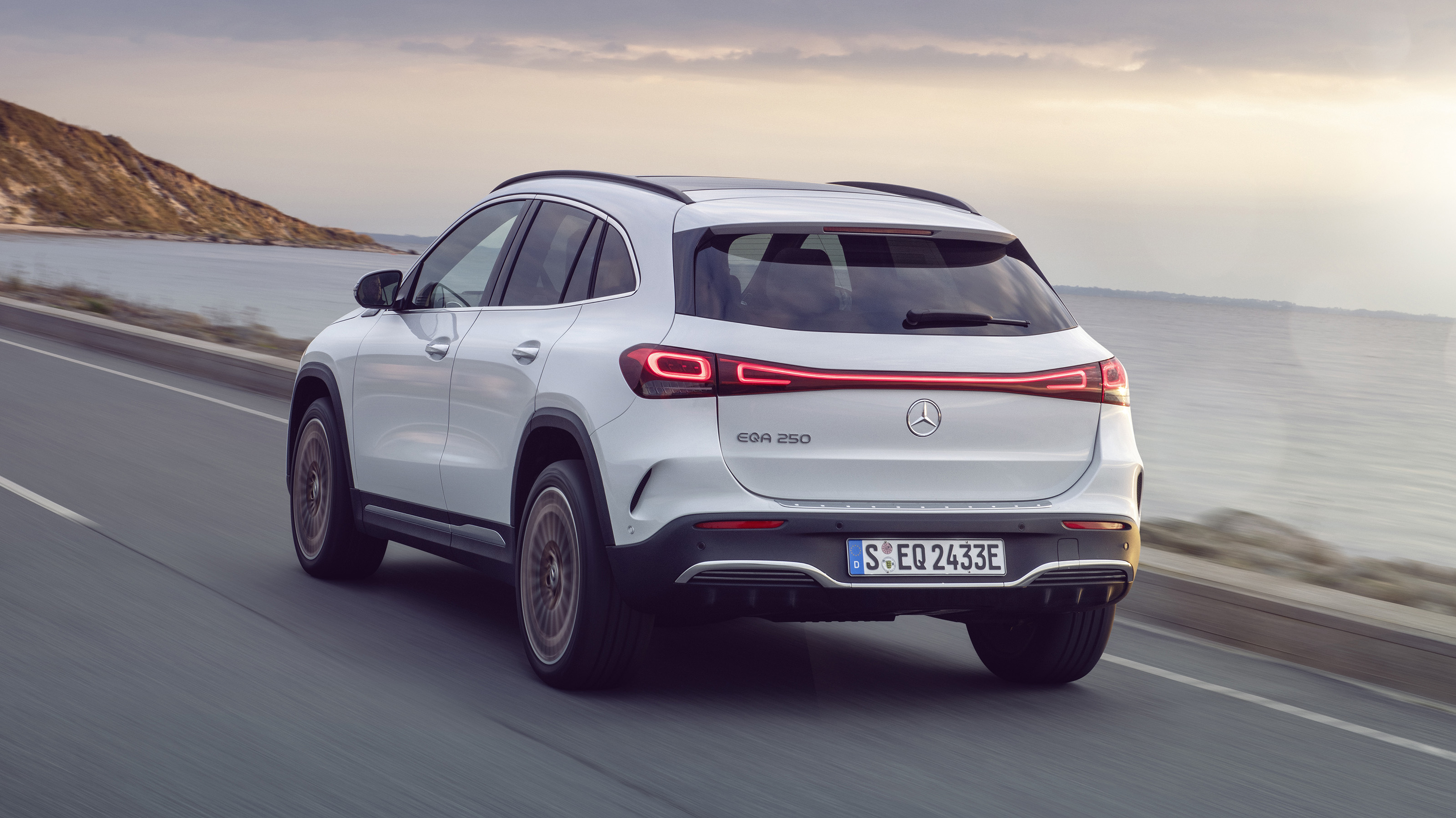 Mercedes EQA driving on road - rear