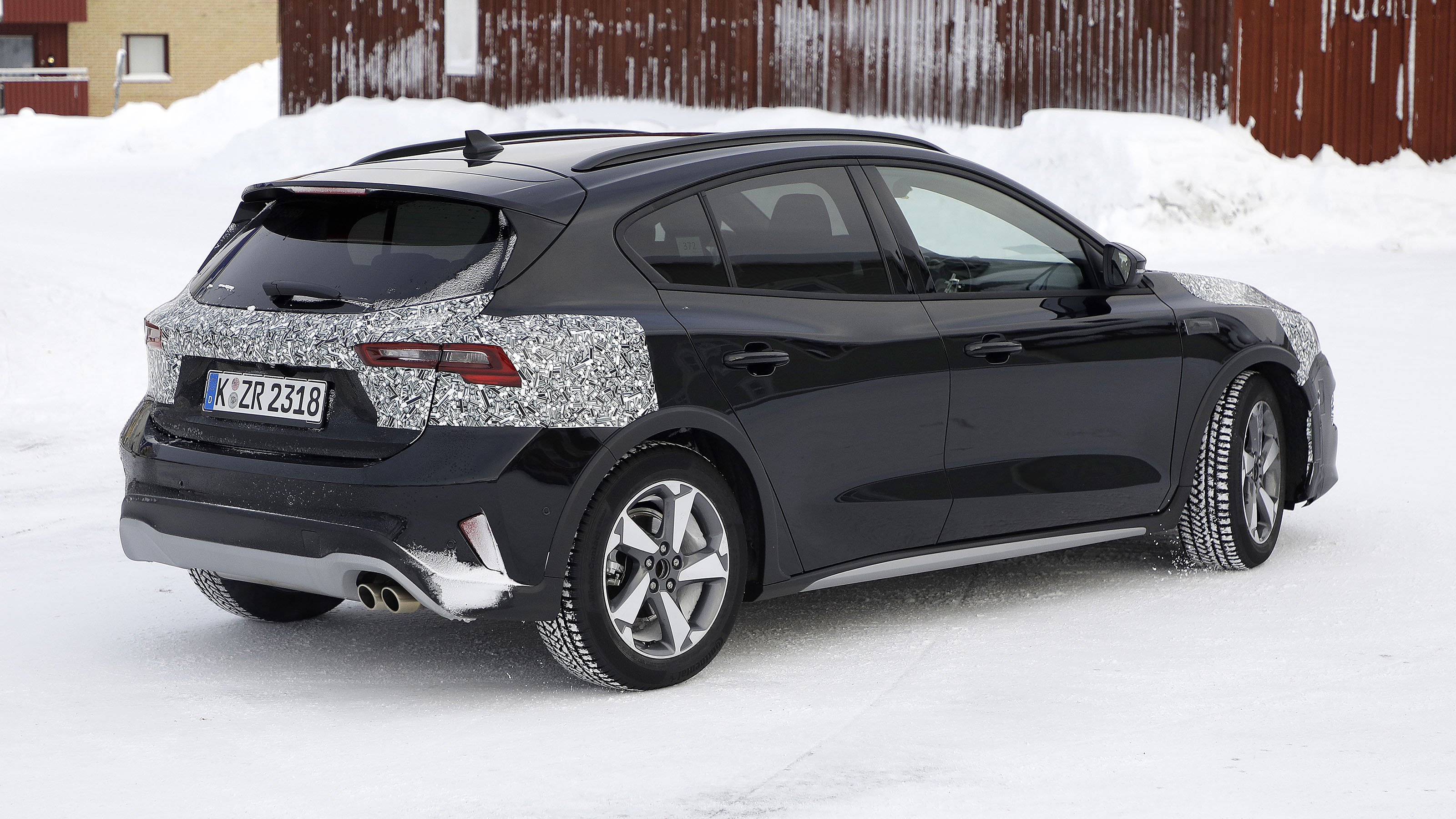 2021 Ford Focus in camouflage - rear side view