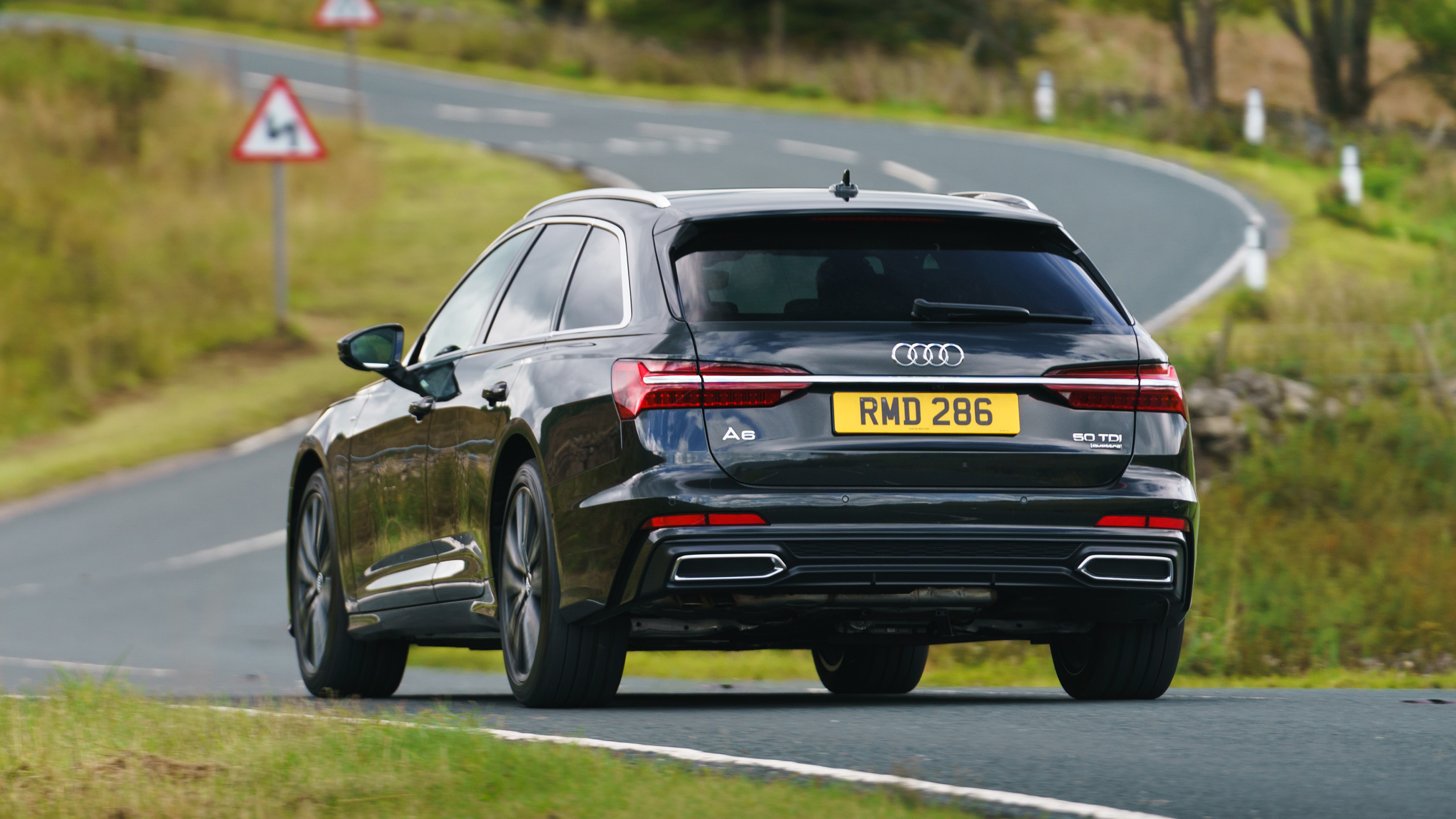 Audi A6 Avant driving - rear view