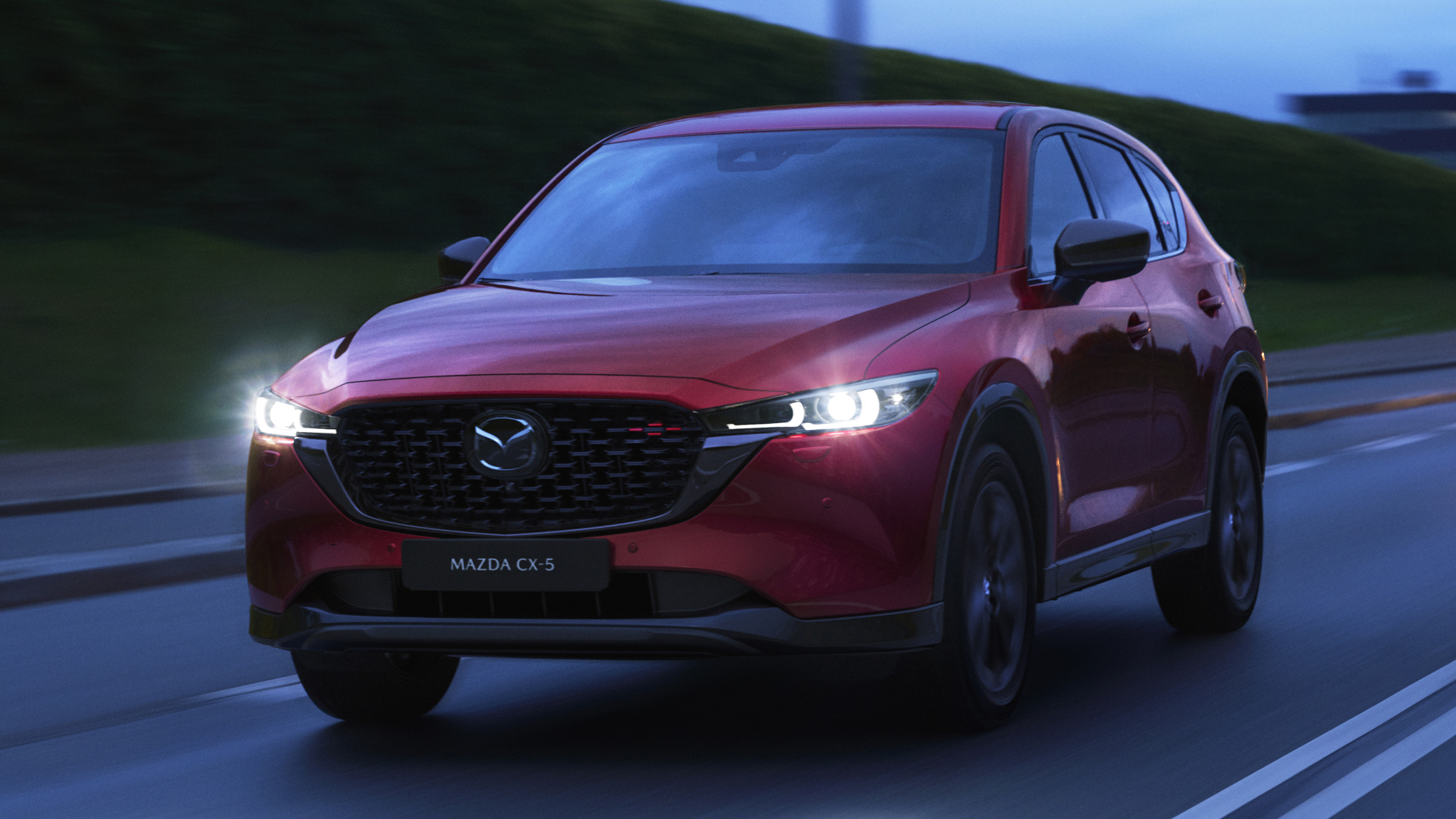 2022 Mazda CX-5 Sport Black driving