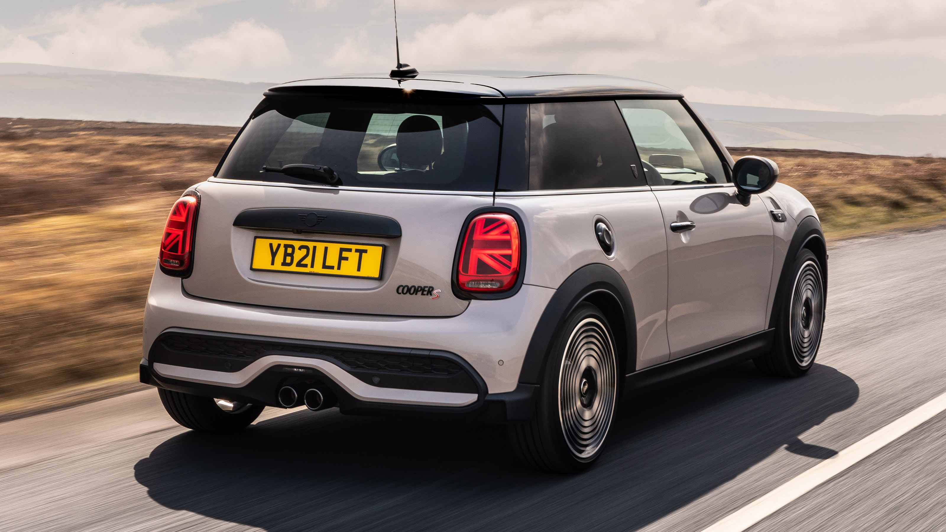 2021 MINI hatchback driving - rear view