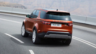 2016 Land Rover Discovery driving - rear view