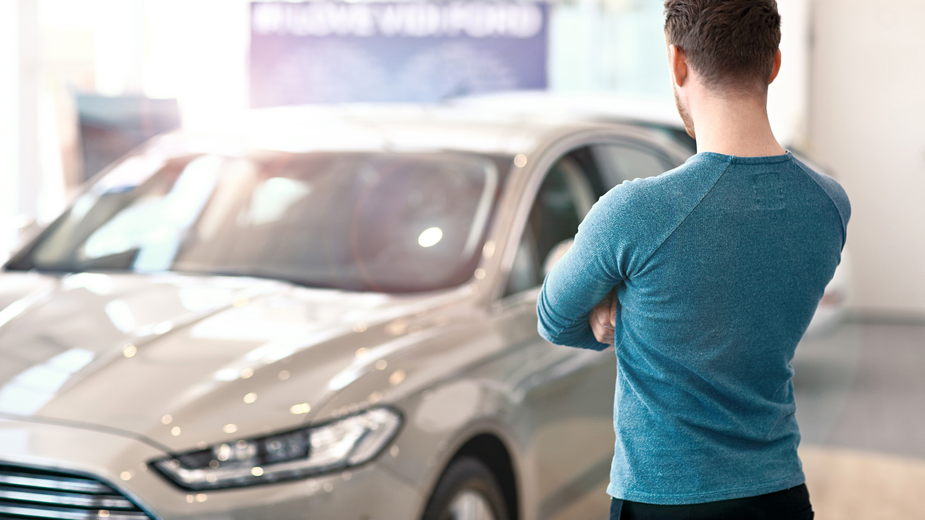 Man standing in front of car
