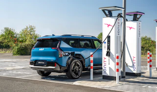 Kia being charged at station