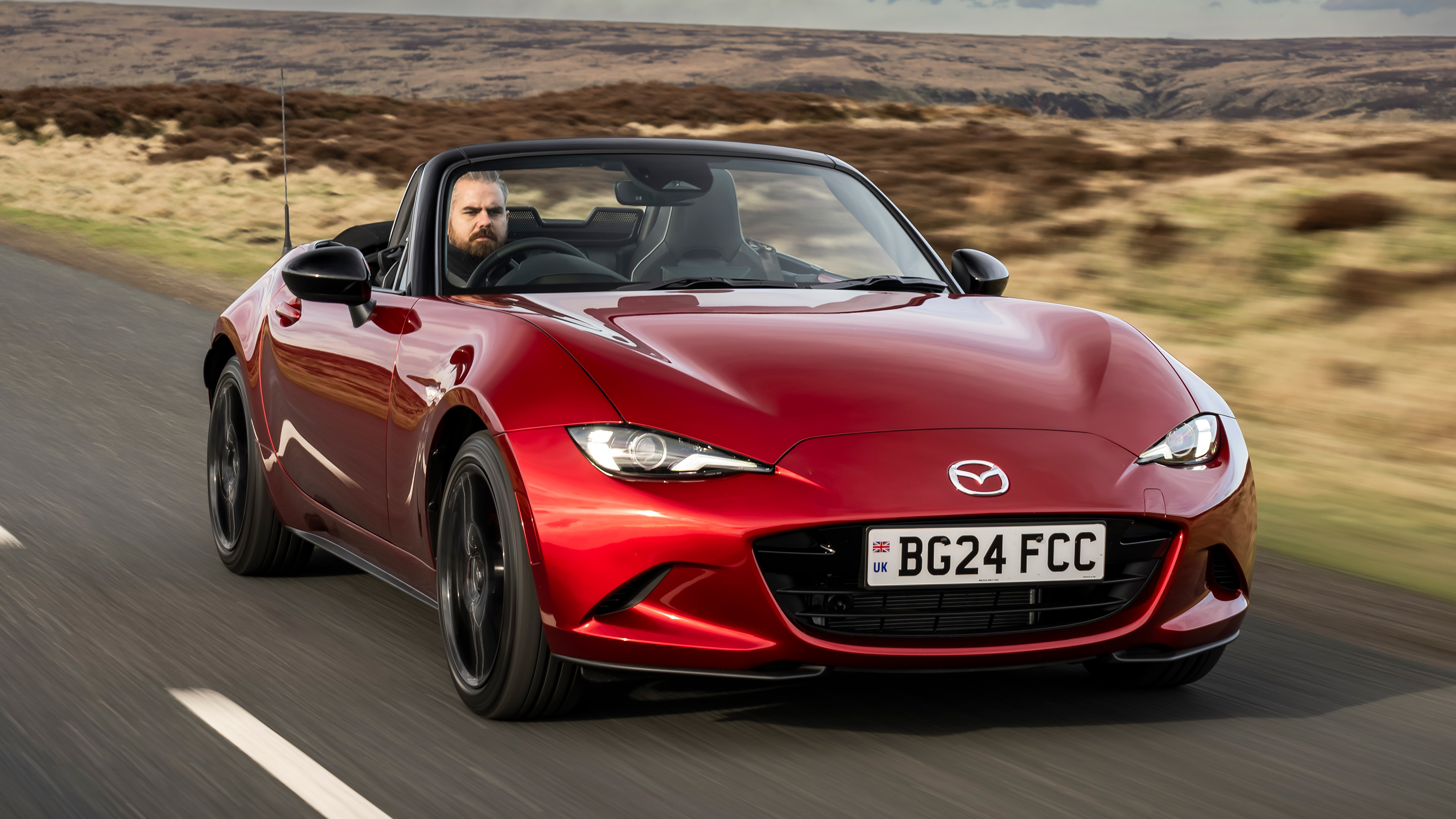 2024 Mazda MX-5 front quarter cruising roof down