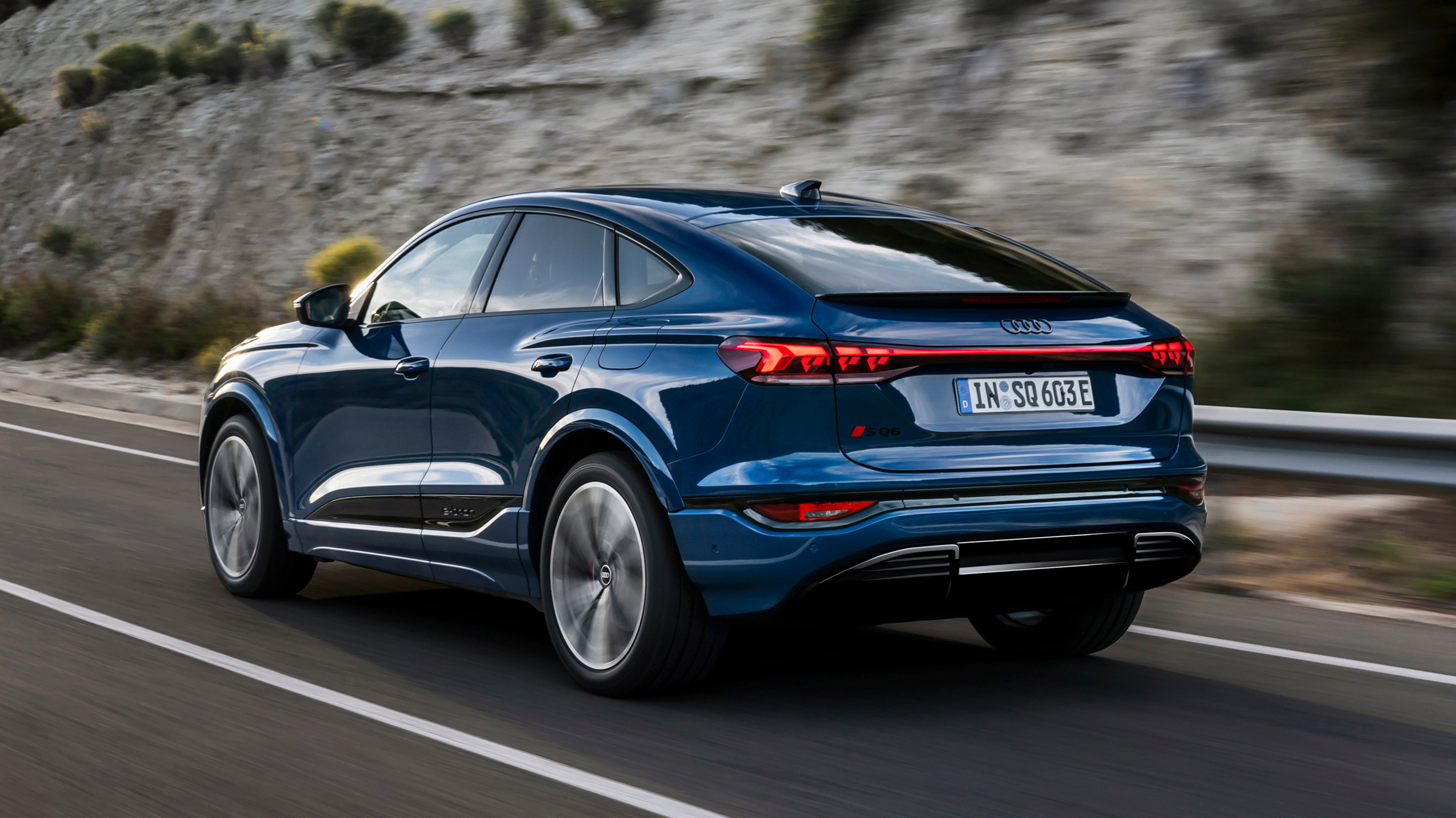Audi Q6 Sportback e-tron driving rear quarter