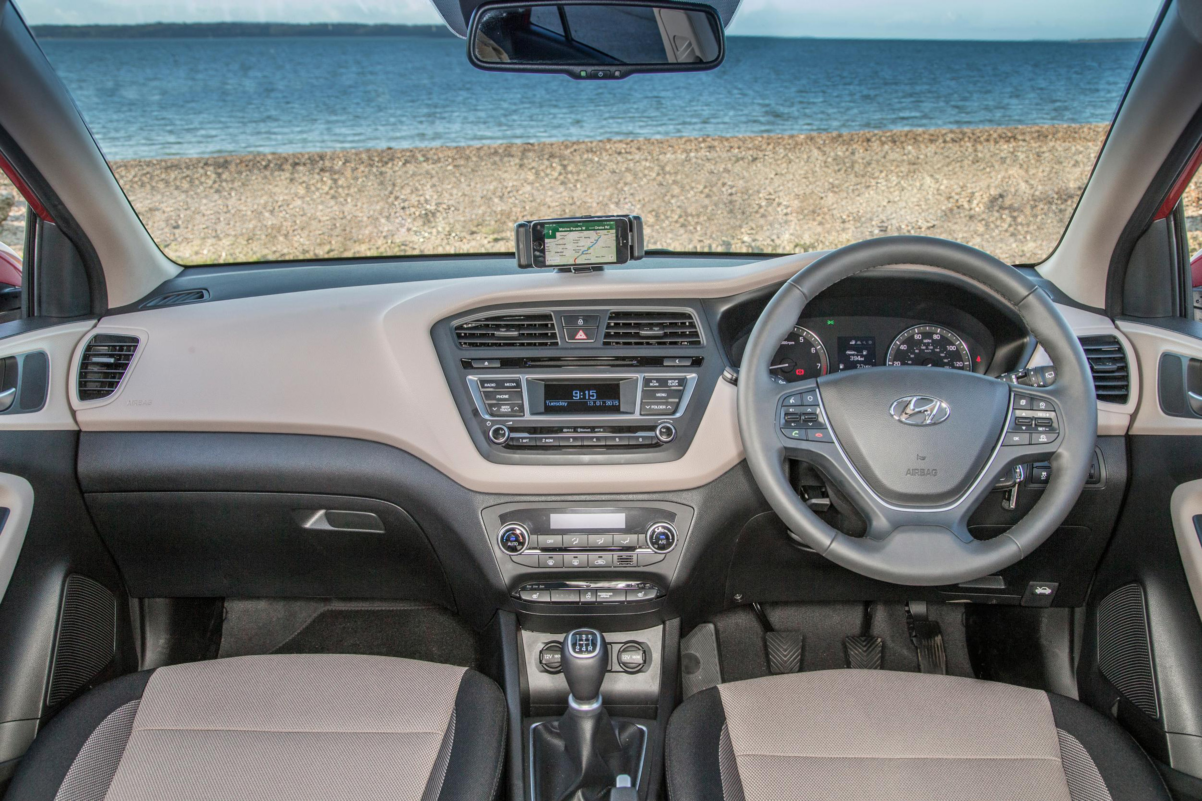 The i20's dashboard looks quite neat, but hard plastics mean parts of the interior feel cheap to the touch