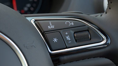 Steering wheel-mounted controls are included as standard