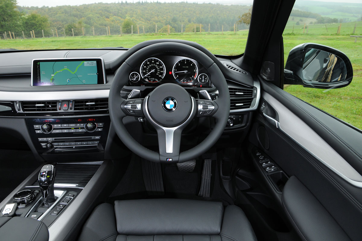 The cabin is dominated by a 10-inch infotainment screen controlled by BMW's iDrive controller