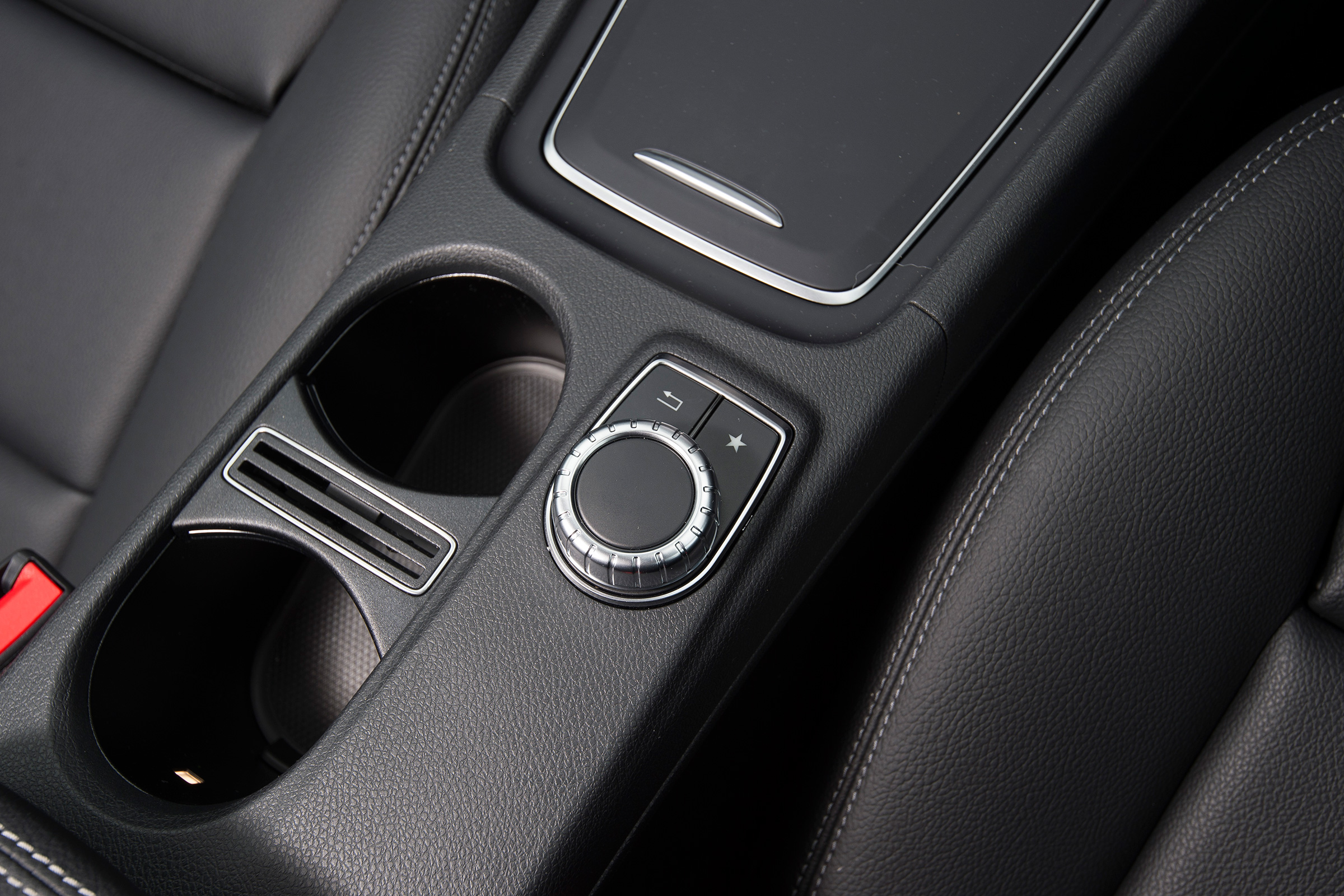 The Comand infotainment system is controlled by a wheel on the console