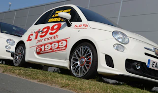 Car on sales forecourt