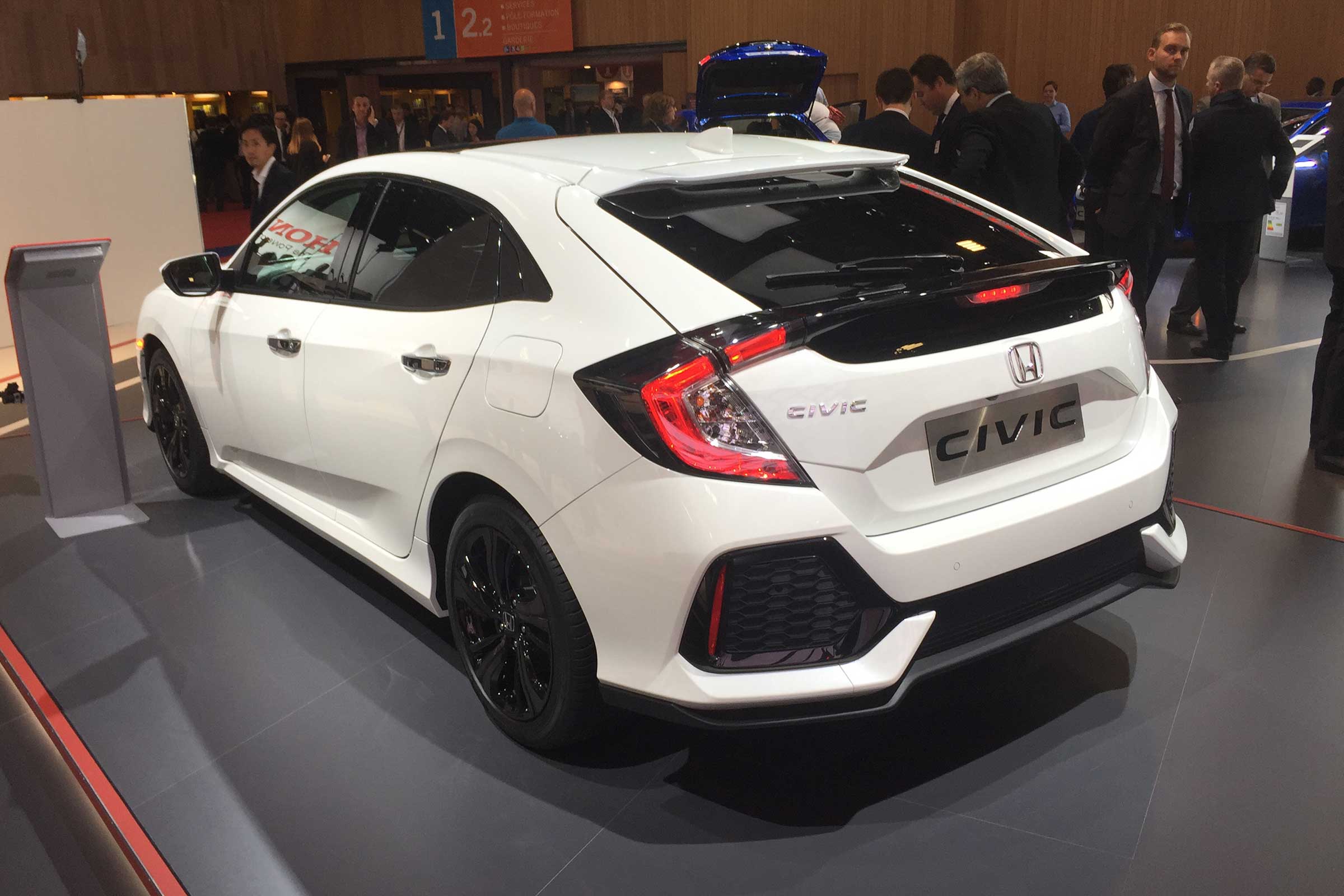 With five readily visible door handles, the new car abandons its previous style