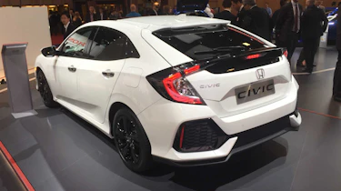With five readily visible door handles, the new car abandons its previous style