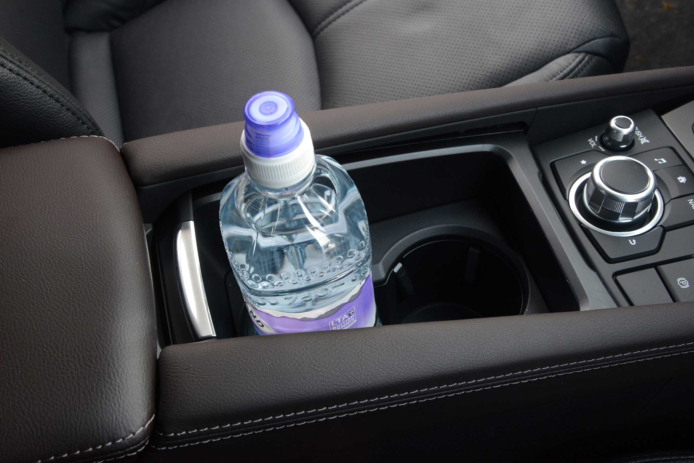 There are several handy storage cubbies inside the Mazda3
