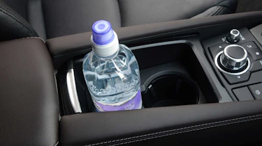 There are several handy storage cubbies inside the Mazda3