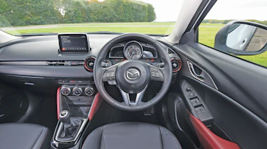 The dashboard has a sporty layout and puts you in the mood for driving fun.