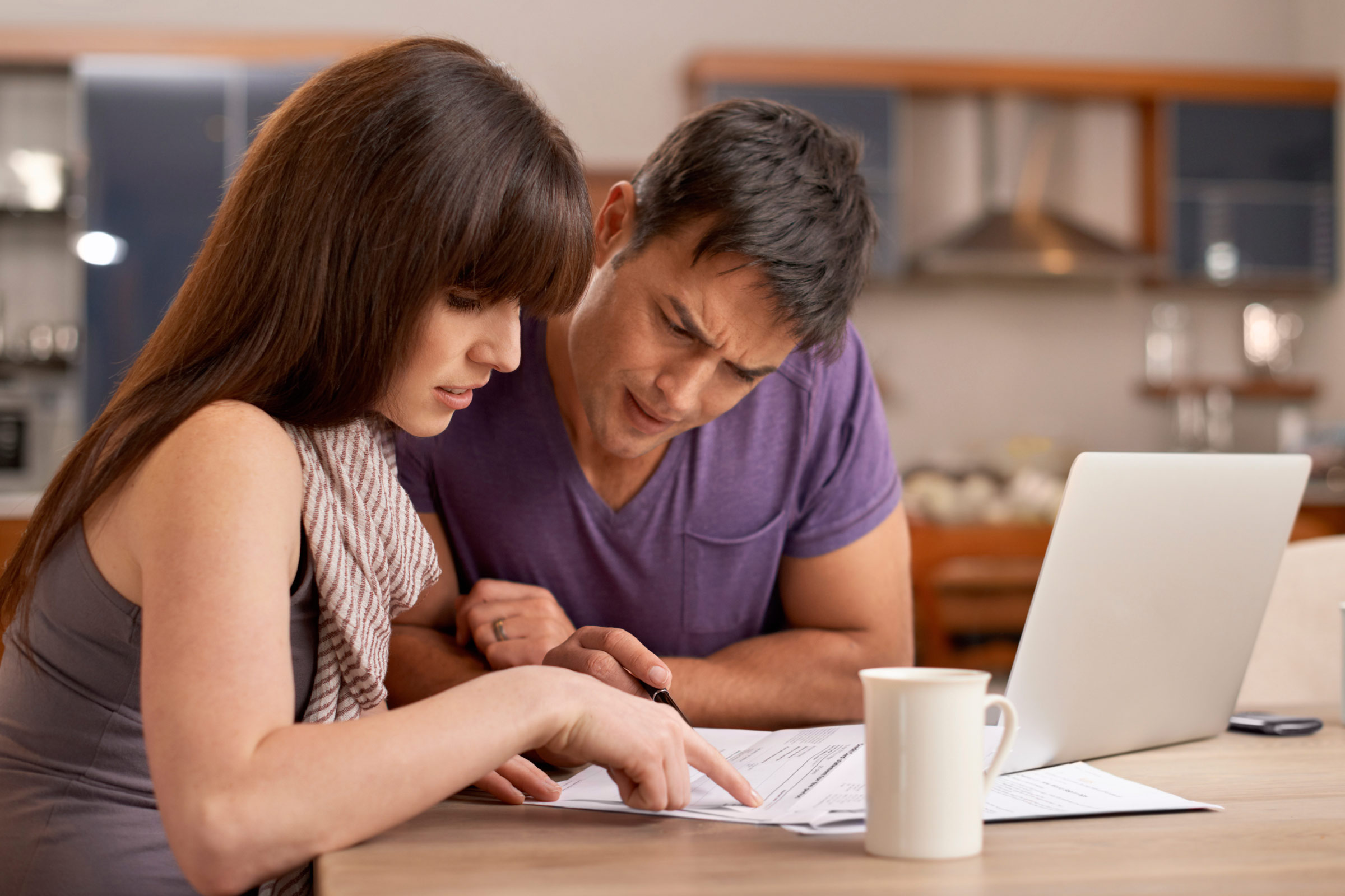 Two people looking at paperwork
