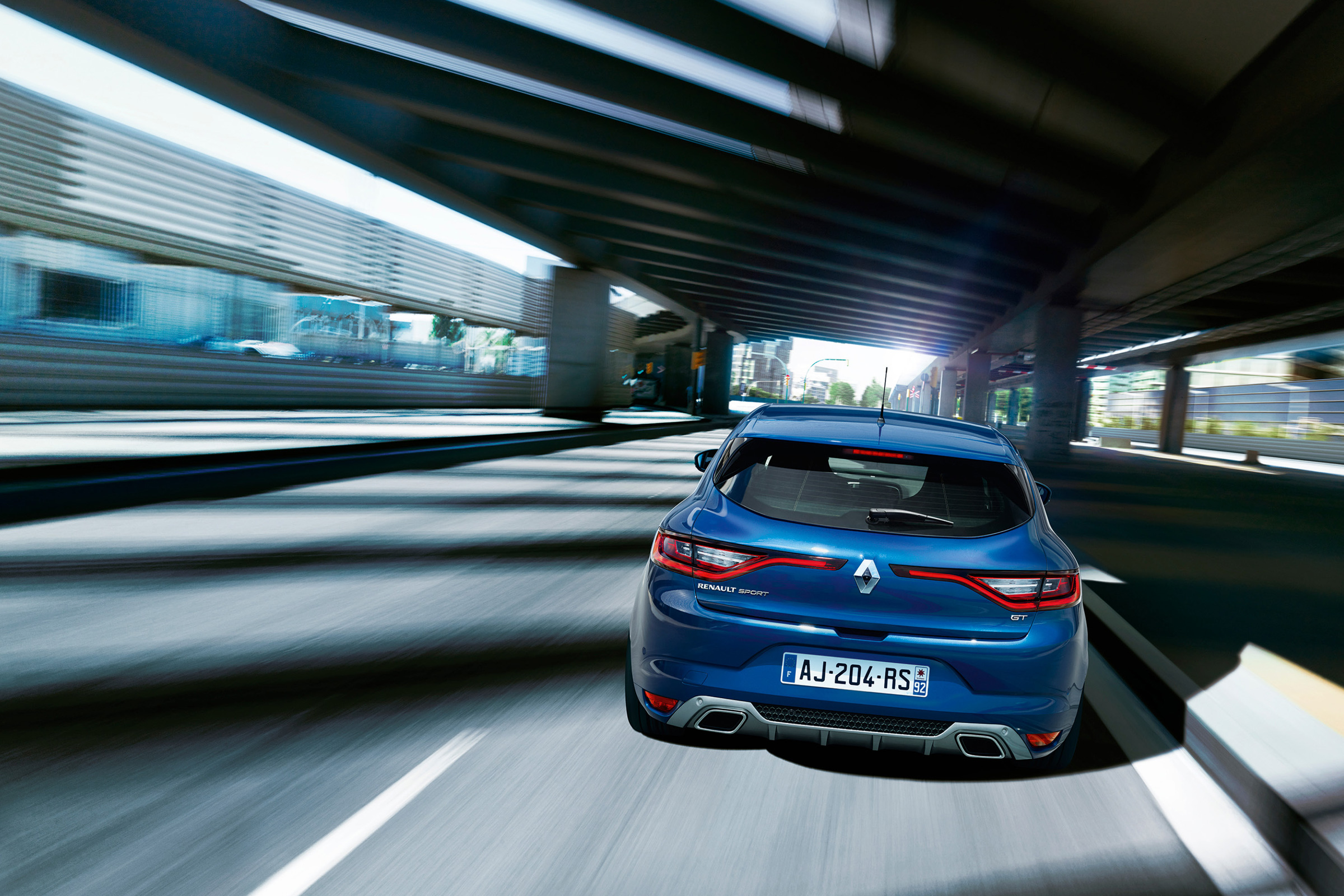 The GT model features trapezoidal exhaust pipes integrated with the rear bumper and unique 18-inch alloy wheels.