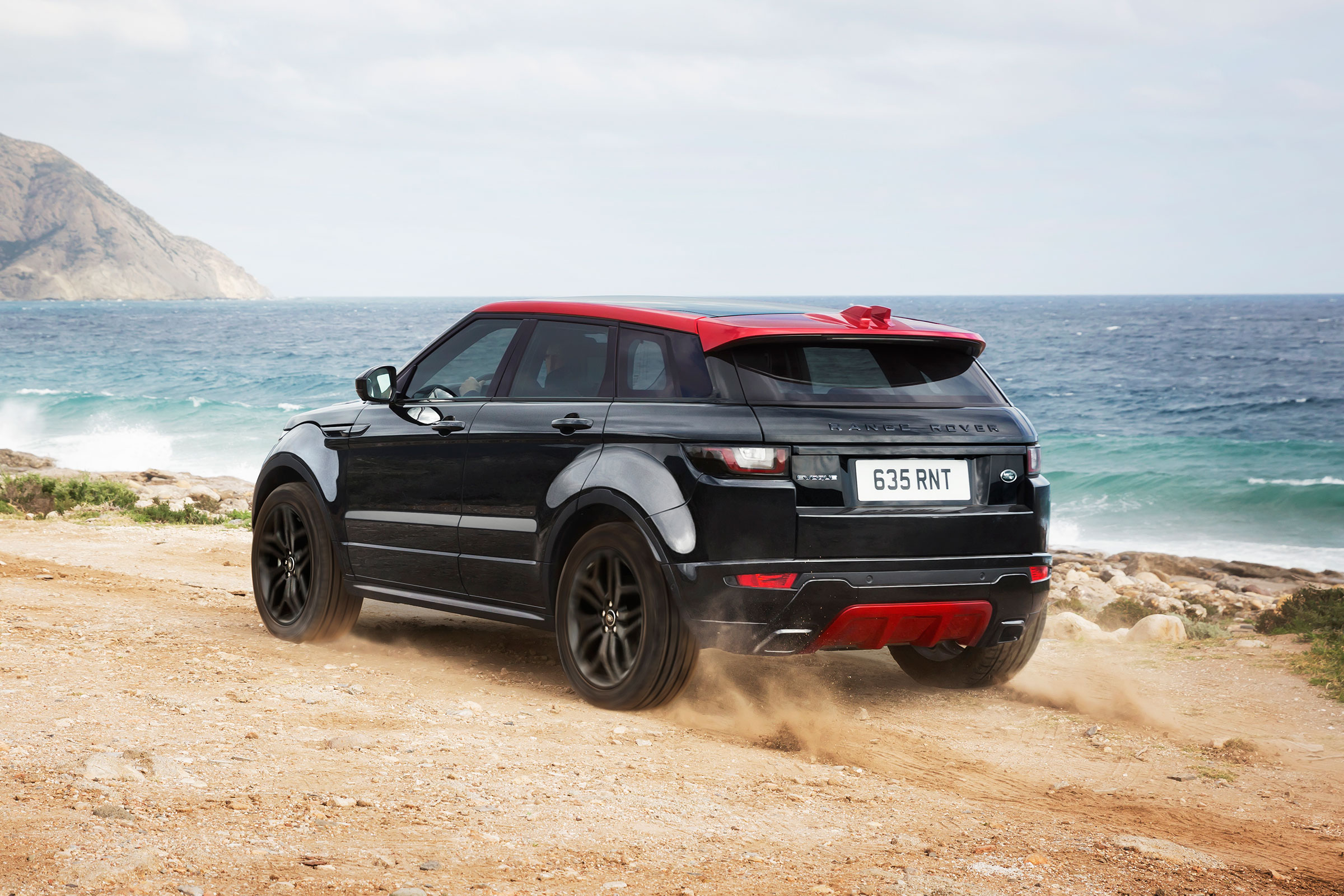 The theme is continued inside with Gloss Black trim and Pimento Red stitching