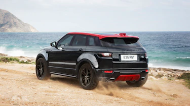 The theme is continued inside with Gloss Black trim and Pimento Red stitching