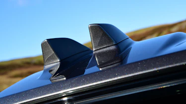 Distinctive dual shark fin antennas help mark the facelifted Evoque out from earlier examples